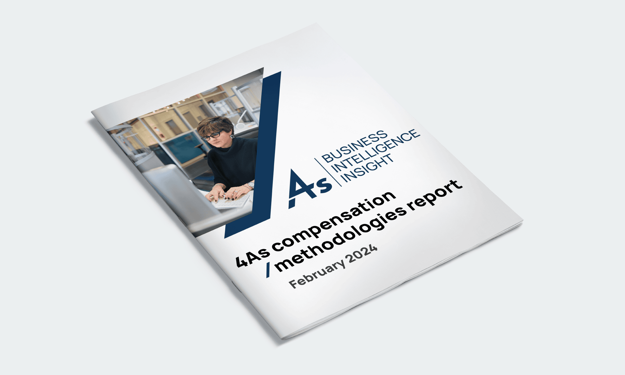 Website Graphics_BII Cover of the 4As Compensation Methodologies Report for February 2024. The design features a person working at a computer and the text Business Intelligence Insight along with the reports title.