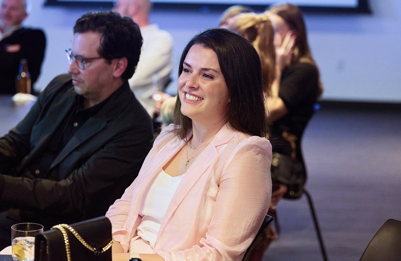 Woman smiling at conference