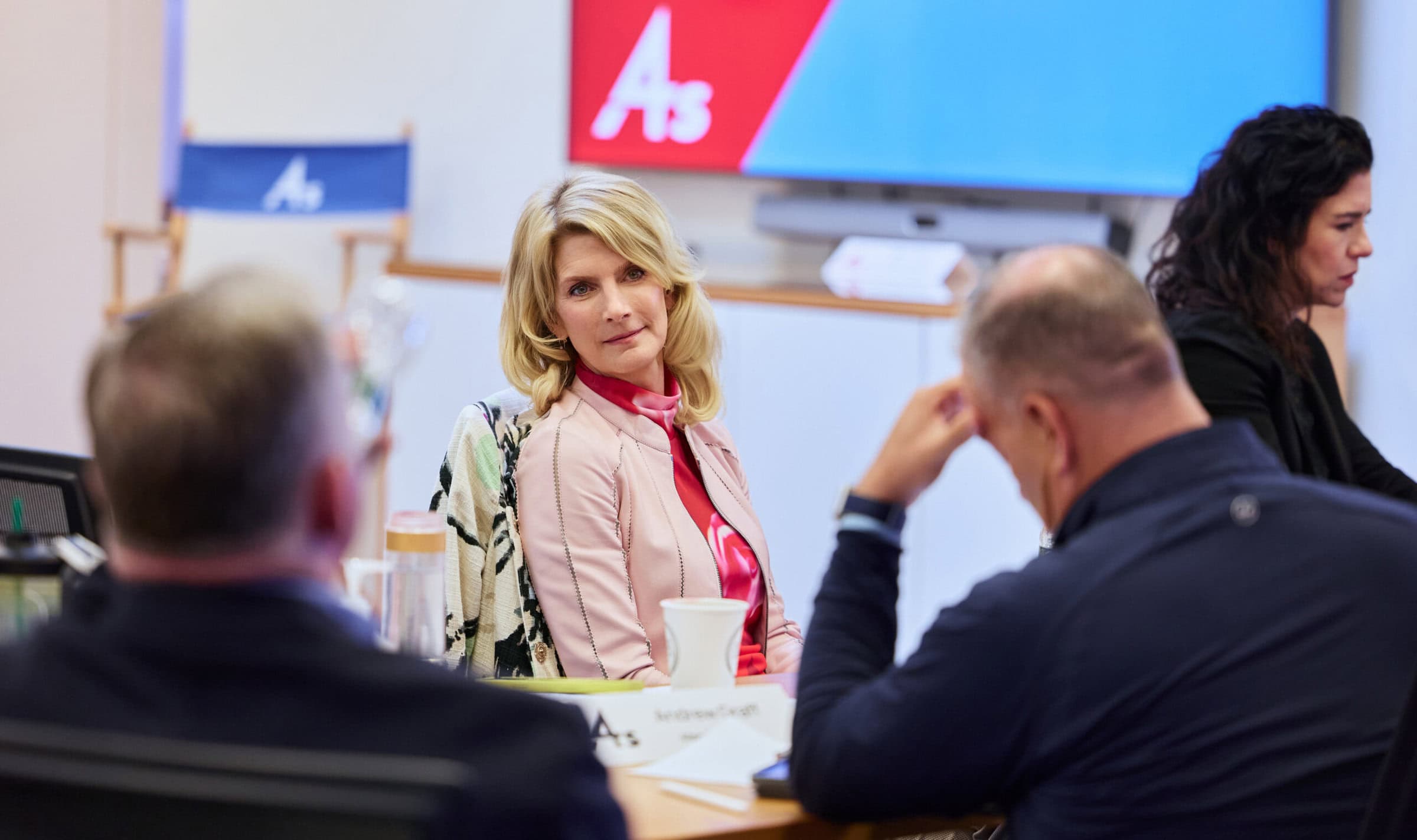 Group of people chatting at event